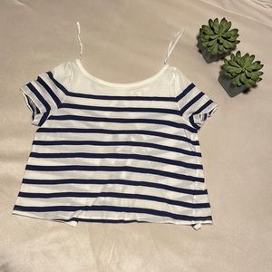 White and blue striped open back tee shirt.